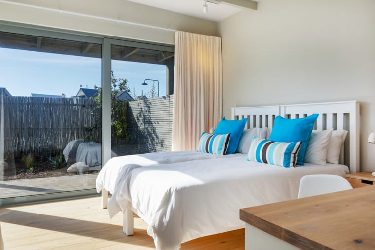 A downstairs bedroom opening onto the courtyard garden