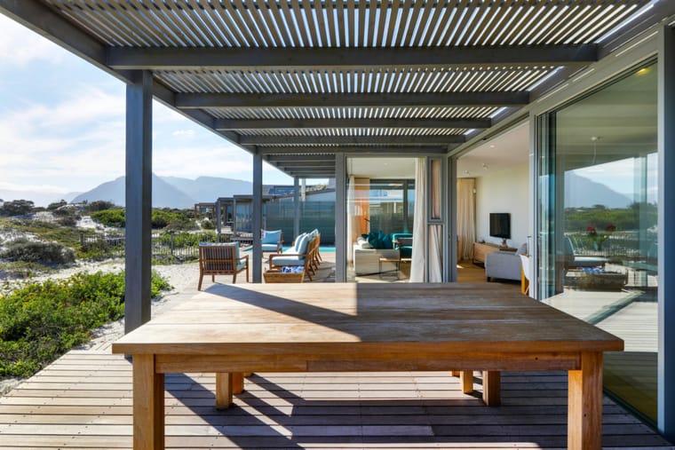 The deck with the living room doors folded fully open