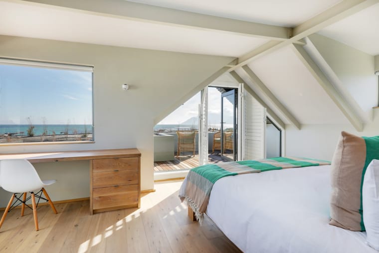 The master bedroom desk positioned at the window above the sea